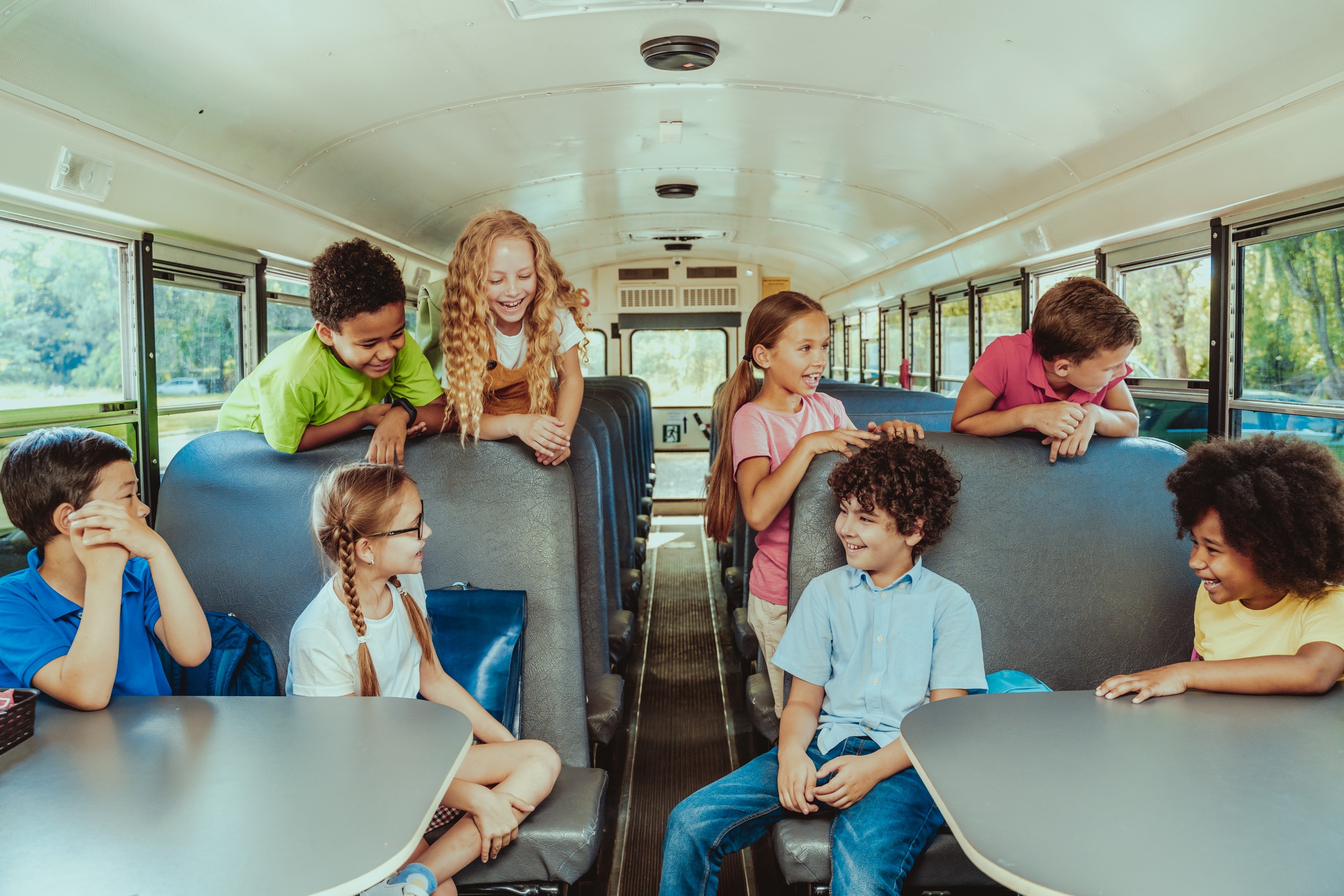 Children talking in a schoolbus