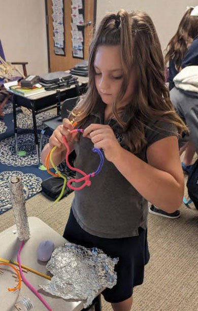 Little Girl Learning in School